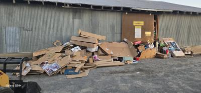 This is a photo of the mess recently left outside the recycle center. The County loses money on the recycle center now; we cannot afford to staff the center seven days a week. Our employees deserve days off, too. PLEASE bring your cardboard earlier in the week, preferably Tuesday and Wednesday if you have large amounts. If the cardboard area is full, DO NOT LEAVE YOUR CARDBOARD OUTSIDE.