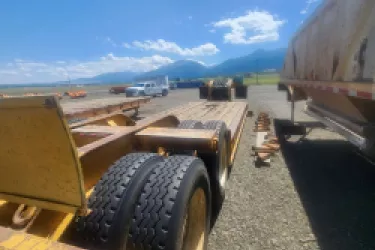 Image of side of lowboy trailer