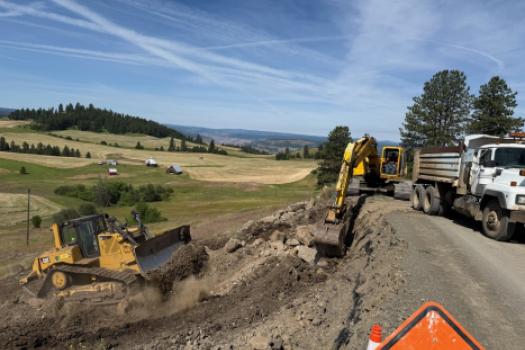 Dozer on road bank