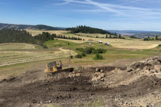 Backhoe on bank
